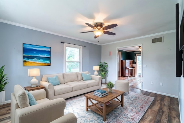 living room featuring ceiling fan, crown molding, and dark hardwood / wood-style flooring