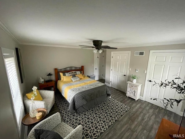 bedroom featuring ornamental molding, ceiling fan, and dark hardwood / wood-style floors