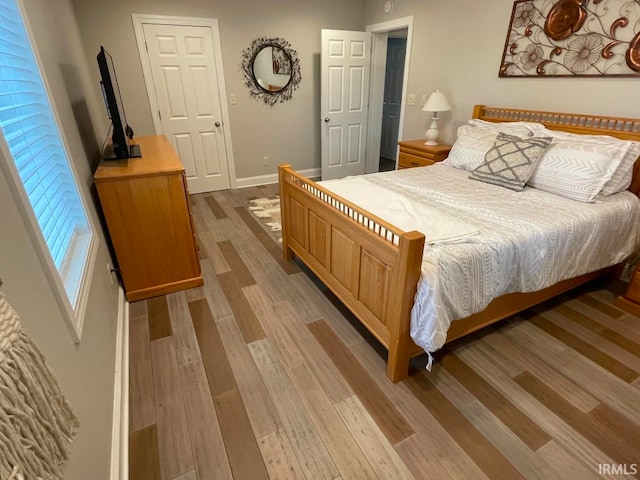 bedroom with light wood-type flooring