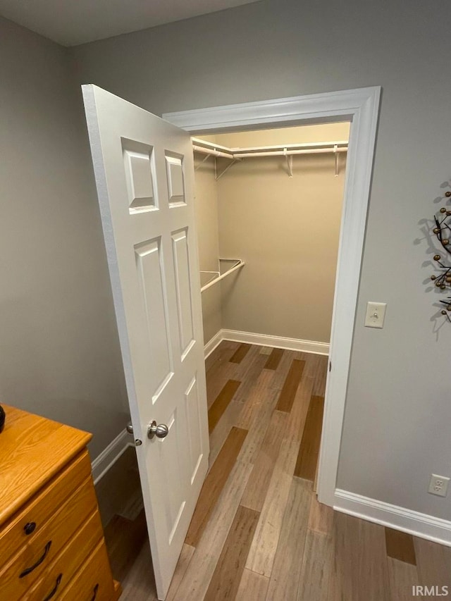 spacious closet featuring light hardwood / wood-style flooring