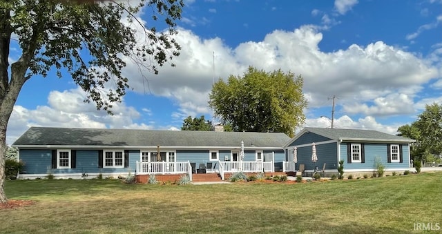 view of front of property featuring a chimney, a wooden deck, and a front yard