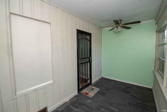 interior space featuring ceiling fan