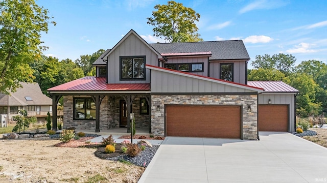 view of front of home with covered porch and a garage