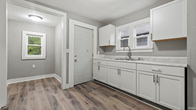 kitchen featuring white cabinets, a textured ceiling, sink, and dark hardwood / wood-style flooring