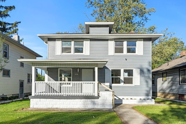 view of front facade featuring a porch and a front yard