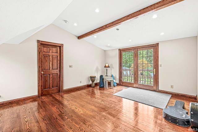 interior space featuring vaulted ceiling with beams and hardwood / wood-style flooring