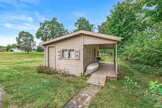 view of outbuilding with a lawn