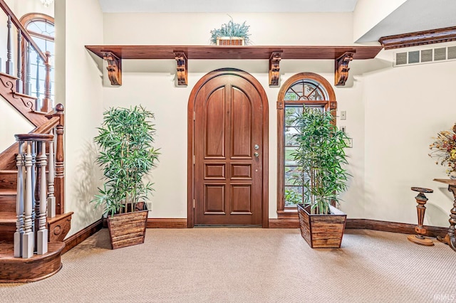 view of carpeted entrance foyer