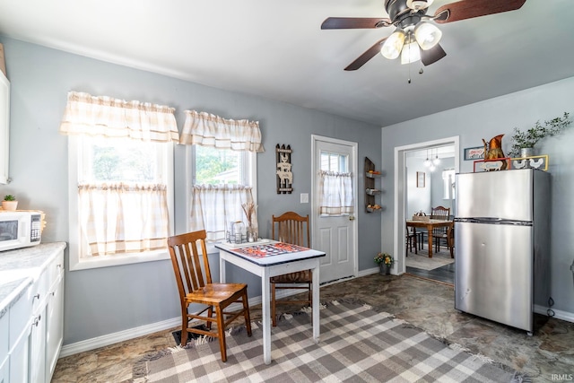 dining space with ceiling fan