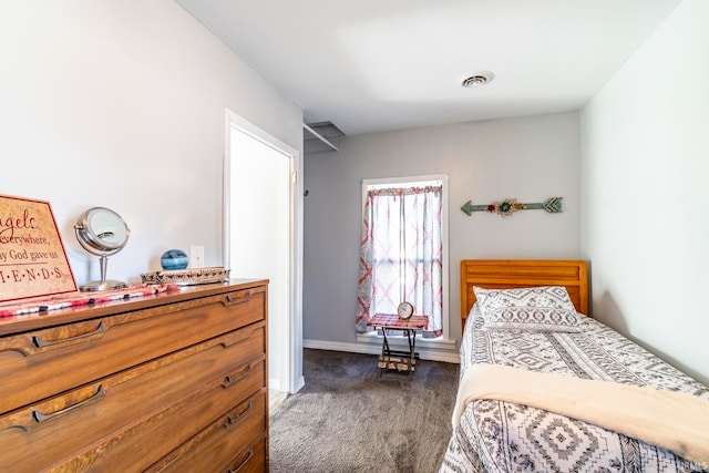 bedroom with dark carpet