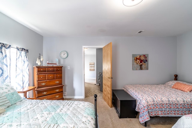 bedroom with light colored carpet