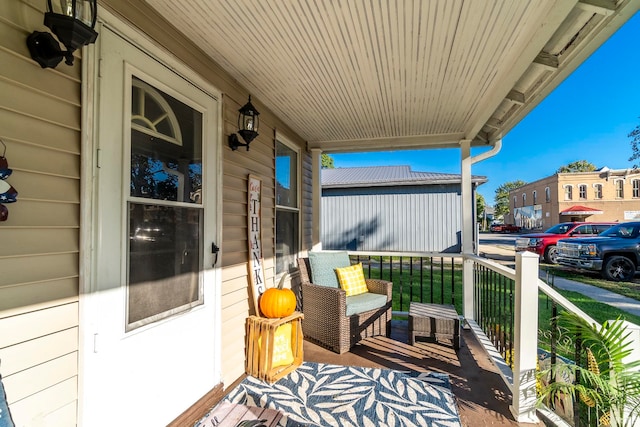 balcony featuring covered porch