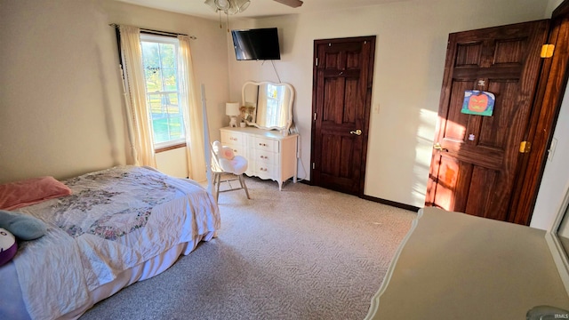 carpeted bedroom with ceiling fan