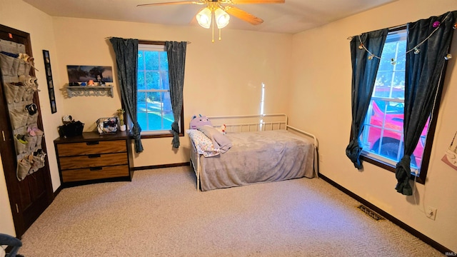 carpeted bedroom featuring ceiling fan