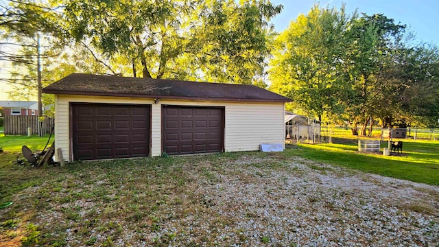 garage with a lawn