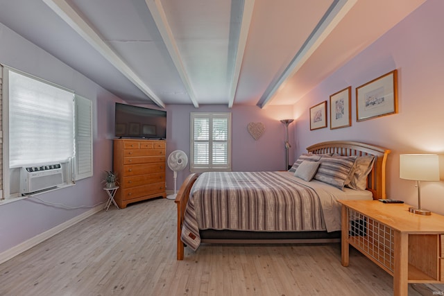 bedroom with beam ceiling, light wood-type flooring, and cooling unit