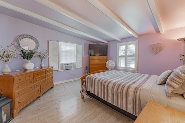 bedroom with lofted ceiling with beams and light hardwood / wood-style flooring