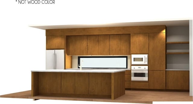 kitchen featuring white appliances, light wood finished floors, modern cabinets, brown cabinets, and light countertops