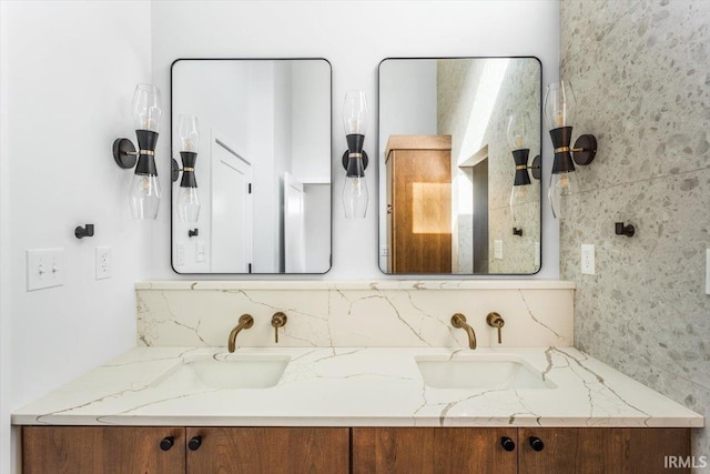 bathroom with double vanity and a sink