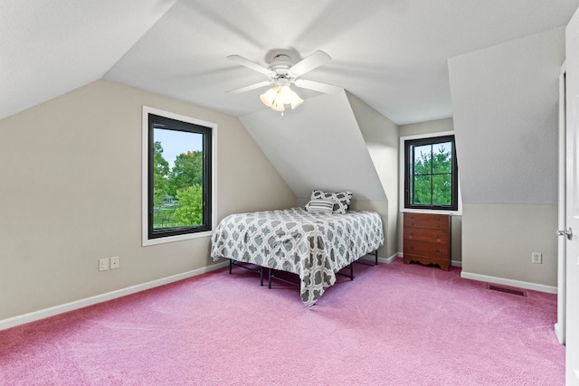 carpeted bedroom featuring ceiling fan and vaulted ceiling