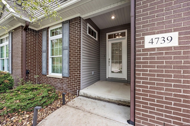 property entrance with brick siding