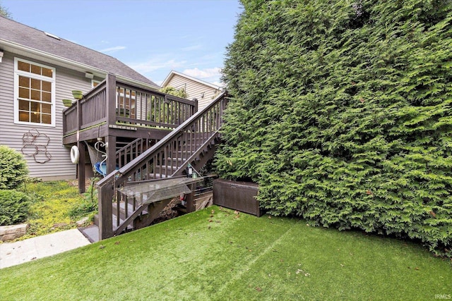 view of yard featuring stairway and a deck