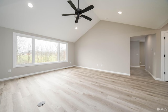 unfurnished living room featuring ceiling fan, vaulted ceiling, and light wood-type flooring