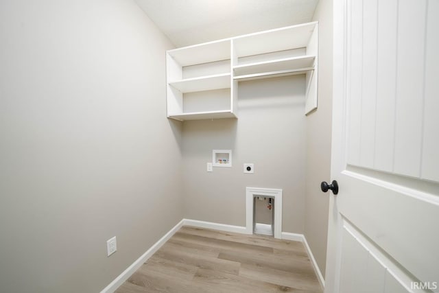 laundry room featuring hookup for an electric dryer, washer hookup, and light hardwood / wood-style floors