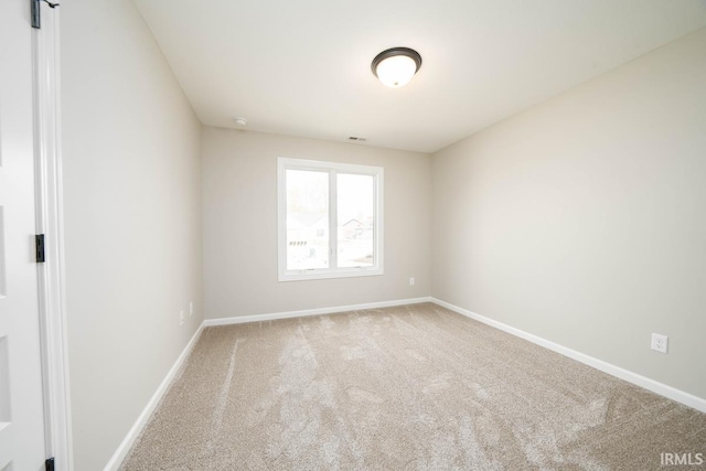 empty room featuring carpet flooring