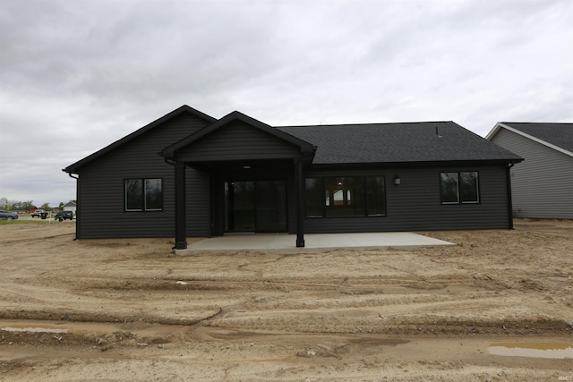 back of property with a patio area