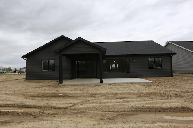 926 Lagonda Trl, Fort Wayne, IN 46818 - back of property with a patio area and a shingled roof