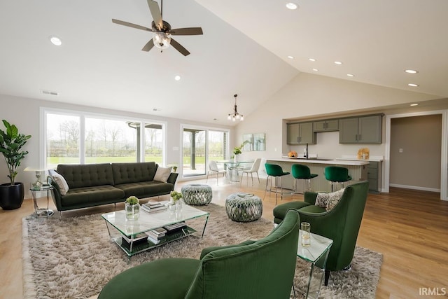 926 Lagonda Trl, Fort Wayne, IN 46818 - living area featuring a chandelier, light wood finished floors, high vaulted ceiling, ceiling fan, and recessed lighting