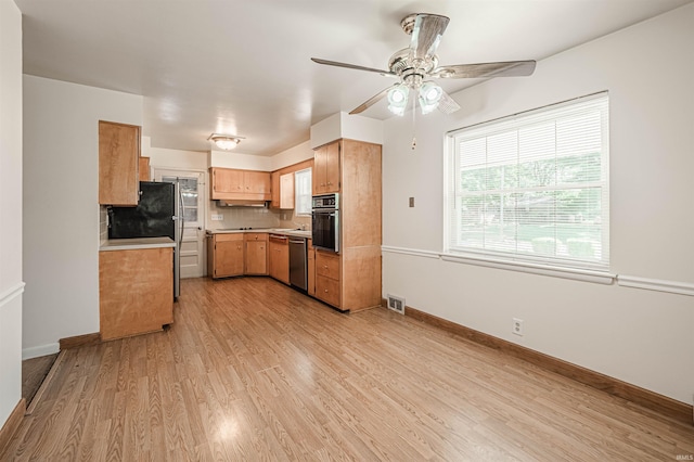 kitchen with backsplash, dishwasher, oven, light hardwood / wood-style flooring, and ceiling fan