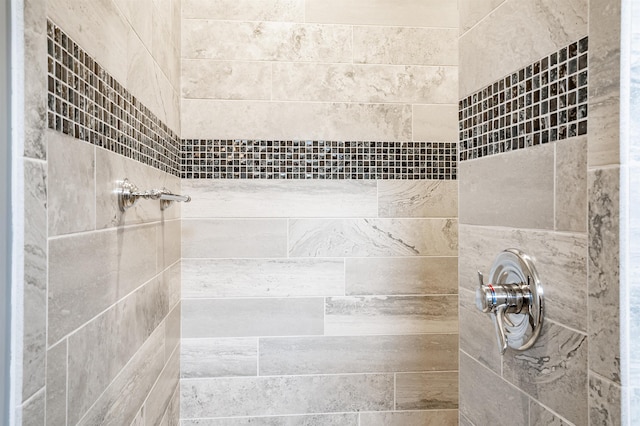 bathroom with a tile shower