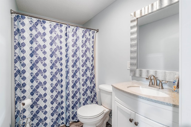 bathroom featuring vanity, toilet, and a shower with shower curtain