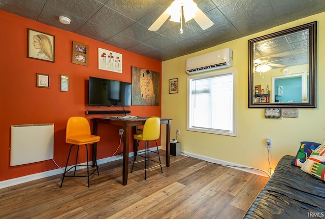 bar with ceiling fan, hardwood / wood-style flooring, and a wall unit AC