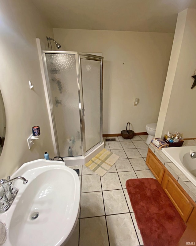 full bathroom with separate shower and tub, tile patterned flooring, toilet, and sink