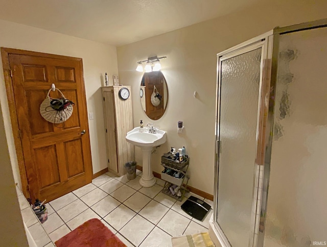 bathroom with tile patterned floors and a shower with shower door