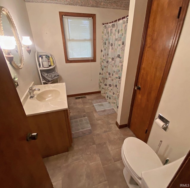 bathroom with vanity, toilet, and a shower with curtain