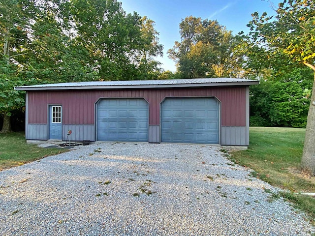 garage featuring a lawn