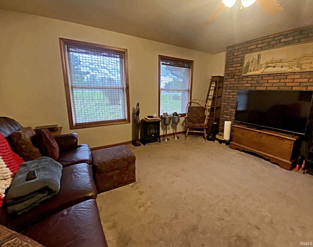 carpeted living room featuring ceiling fan