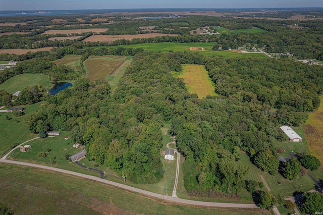 birds eye view of property featuring a rural view and a water view