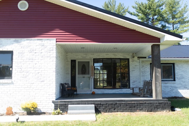 doorway to property with a porch