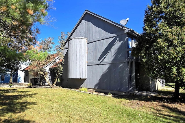 view of home's exterior with a yard