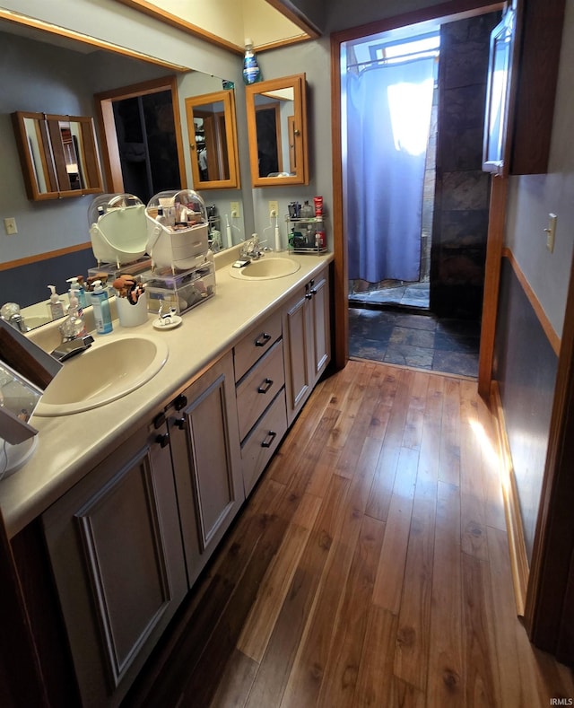 bathroom featuring vanity and hardwood / wood-style flooring