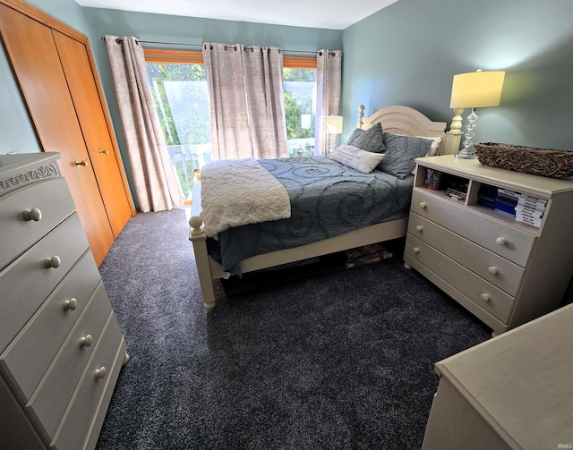 carpeted bedroom featuring a closet