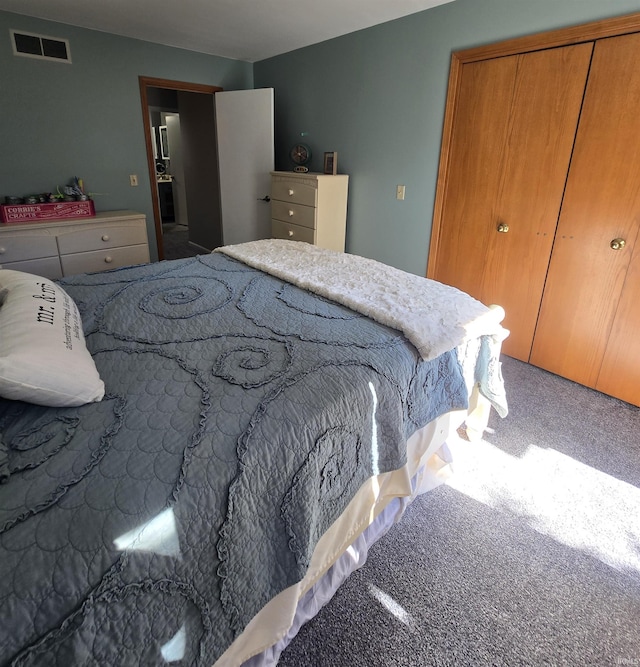 carpeted bedroom with a closet