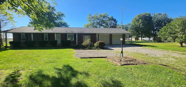 single story home with a front lawn, a porch, and a garage