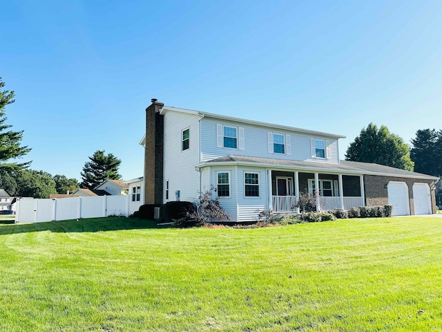 view of front of home featuring a front lawn and covered porch