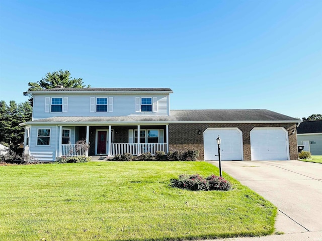 view of front of home with a front lawn, a porch, and a garage